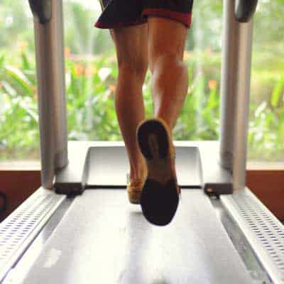 man running on a treadmill for good health